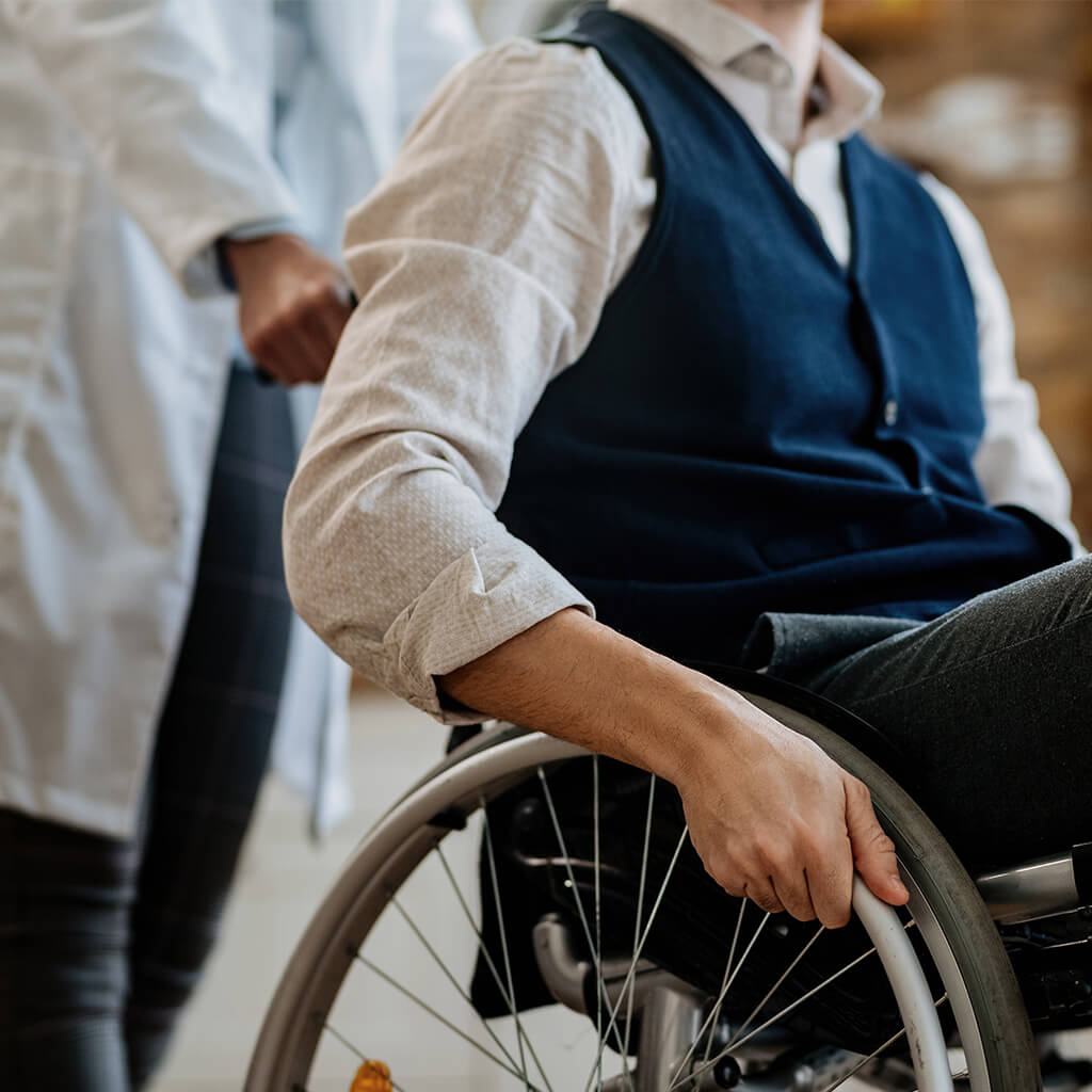 man in wheelchair with doctor in hospital setting 2026 03 16 06 26 24 utc